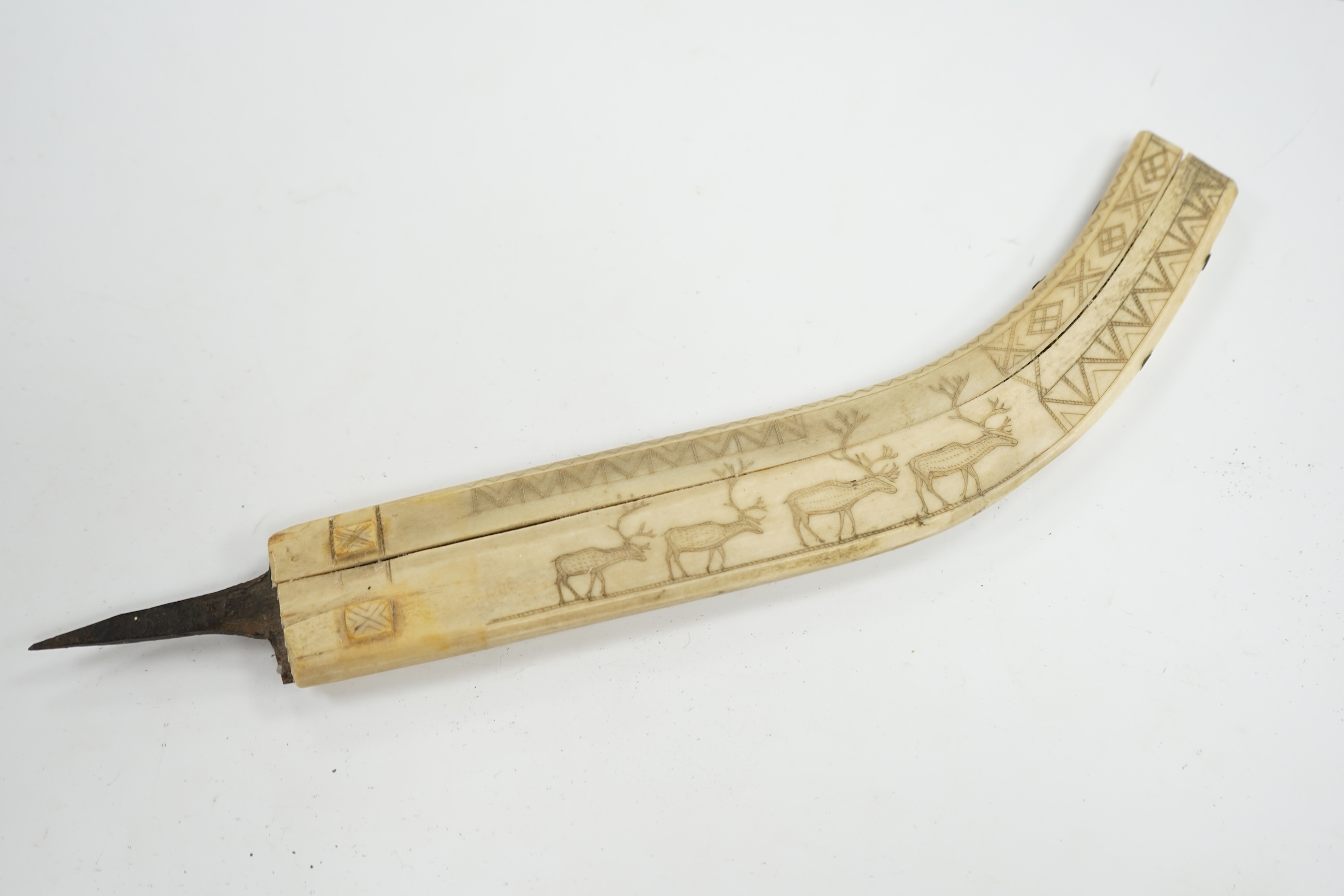 An Inuit? decorated bone blade sheath, 26cm in length. Condition - poor to fair